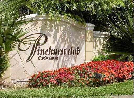 a view of a street with a building in the background