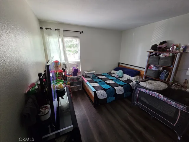 a bedroom with furniture and a window