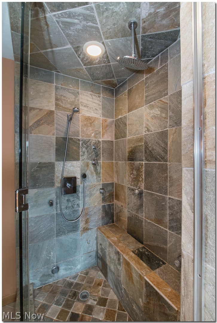 1237 Washington Avenue, Unit 1209 Cleveland, OH 44113 - Photo 23 of 33 LRG MAST SHOWER WITH MULIT HEAD, STEAM, SLATE TILE, CUST GLASS SHOWER DOORS.RAINDROP SHOWER HEAD