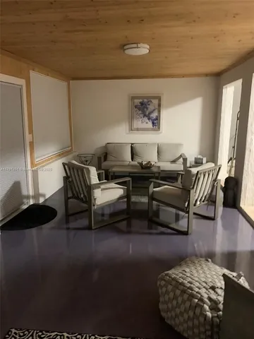 a view of a room that has a large window