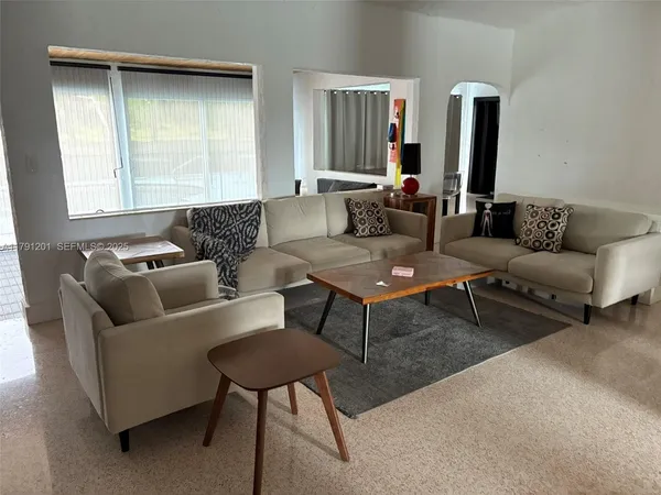 a workspace with furniture and a window