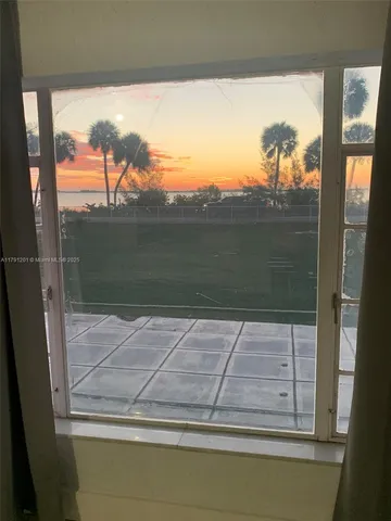 a view of a swimming pool with a yard