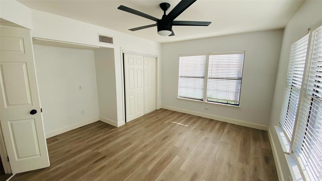 5003 Bryan Street, Unit 6 Dallas, TX 75206 - Photo 6 of 9 a view of empty room with wooden floor and fan