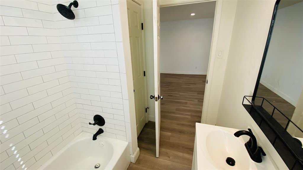 5003 Bryan Street, Unit 6 Dallas, TX 75206 - Photo 9 of 9 a bathroom with a bathtub and shower
