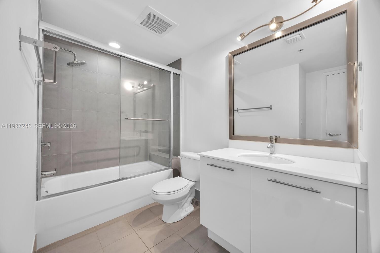 92 Southwest 3rd Street, Unit 3904 Miami, FL 33130 - Photo 18 of 23 a bathroom with a sink toilet and shower