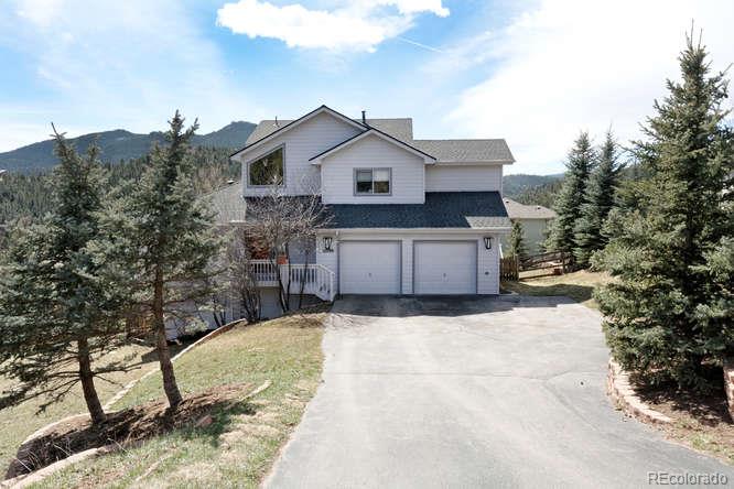 27199 Sun Ridge Drive Evergreen, CO 80439 - Photo 1 of 1 a house view with a outdoor space