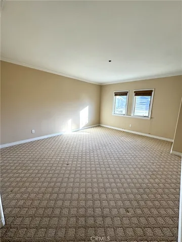 a view of empty room with windows