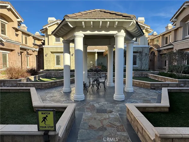 a view of a building with seating area