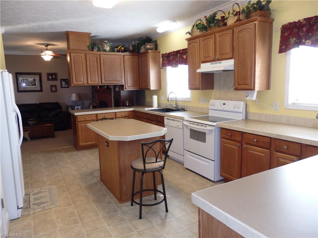 2252 Ross Wood Road Trinity, NC 27370 - Photo 11 of 30 kitchen with island and lot of cabinets