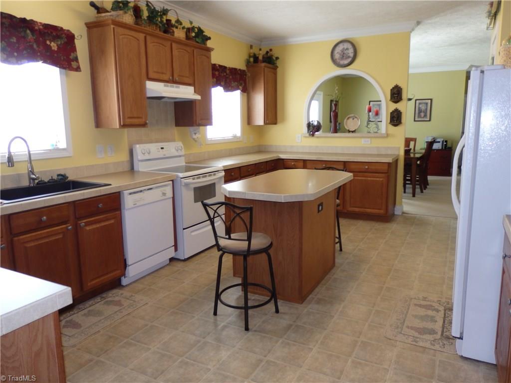 2252 Ross Wood Road Trinity, NC 27370 - Photo 12 of 30 kitchen has range, dishwasher and exhaust fan plus pantry