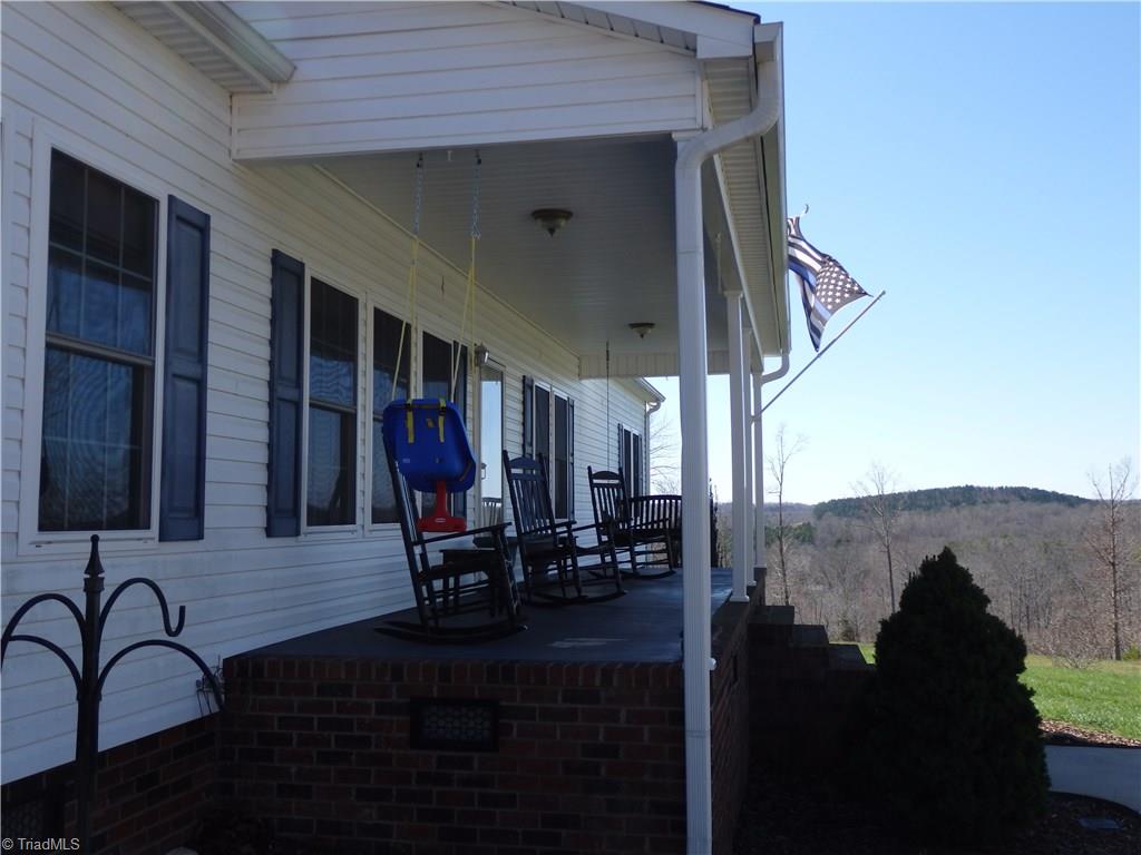 2252 Ross Wood Road Trinity, NC 27370 - Photo 3 of 30 covered front porch with panoramic views