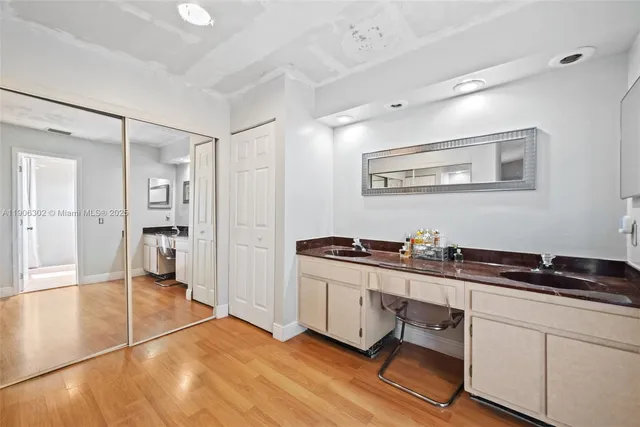 a kitchen with a sink and cabinets