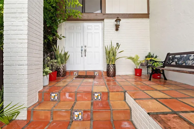 a building with potted plants in front of it