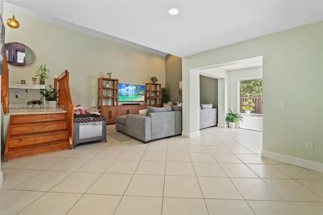 a view of a livingroom with furniture and a flat screen tv