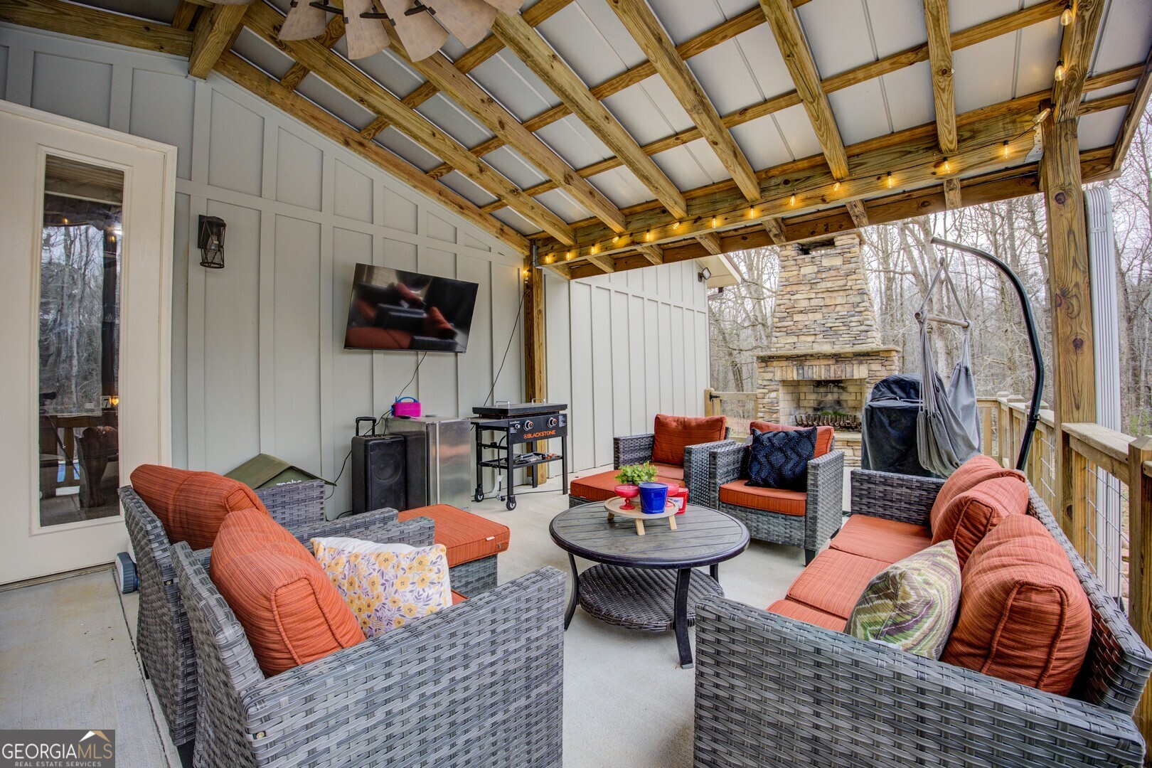 2049 Midway Church Road Newborn, GA 30056 - Photo 34 of 71 a outdoor living space with furniture and a flat screen tv