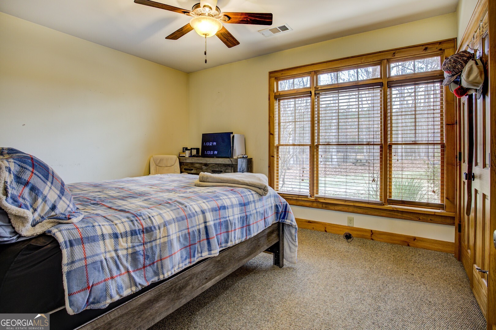 2049 Midway Church Road Newborn, GA 30056 - Photo 45 of 71 a bed sitting in a bedroom next to a window