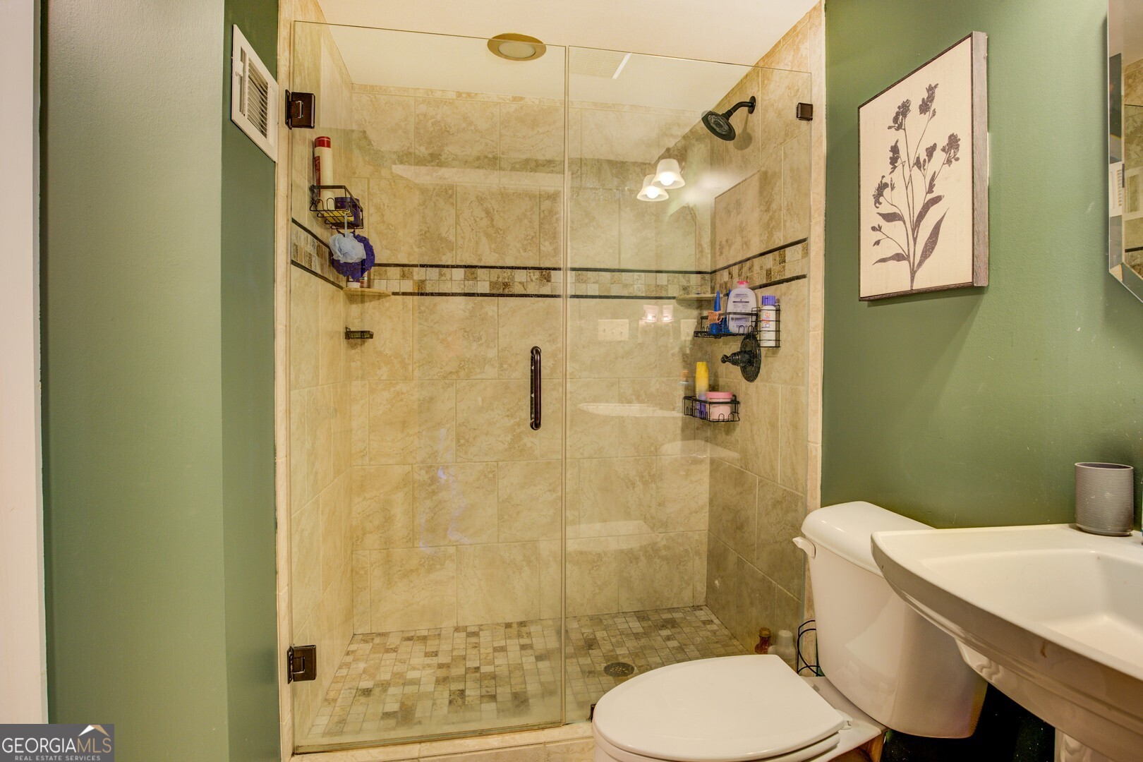 2049 Midway Church Road Newborn, GA 30056 - Photo 49 of 71 a white toilet sitting next to a bathroom sink