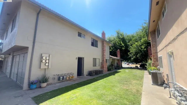 a view of a backyard with furniture