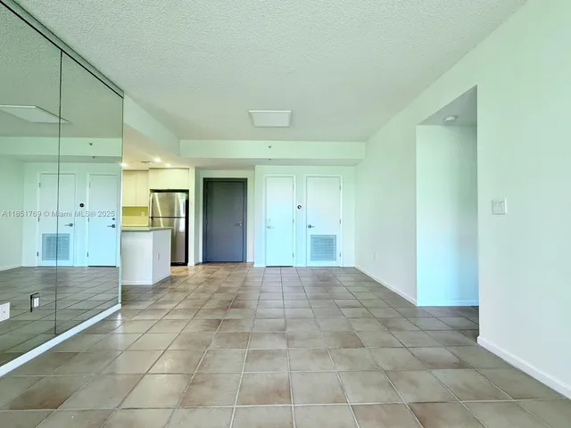 a view of a bathroom with a sink and a mirror