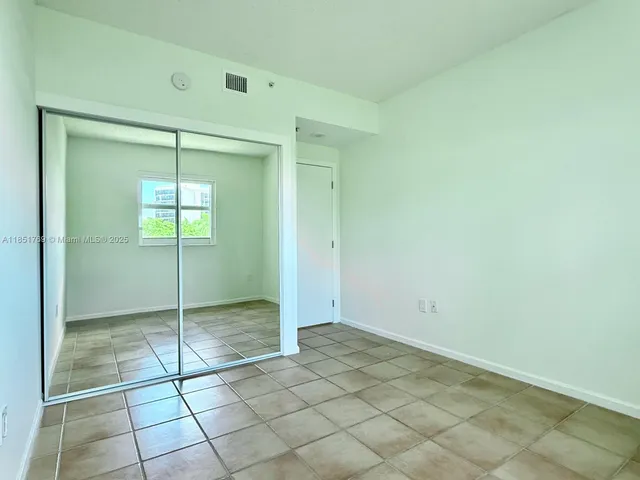 a bathroom with a granite countertop sink a toilet and bathtub