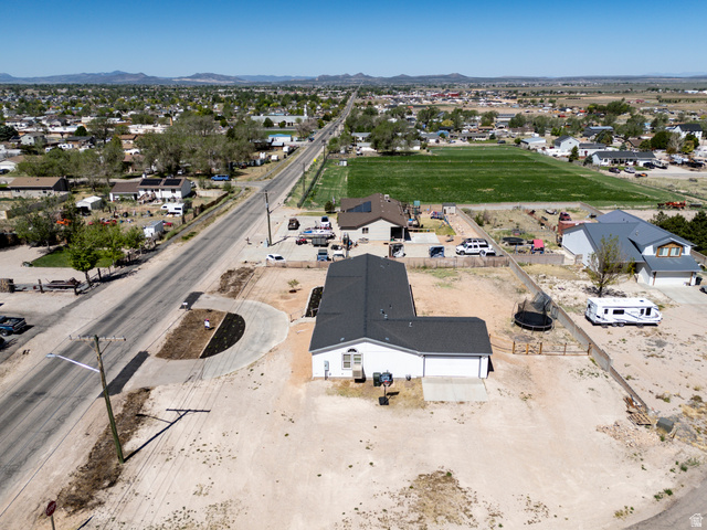 1637 East Midvalley Road Enoch, UT 84721 - Photo 43 of 48 Single-story property featuring a white exterior with dark roof shingles