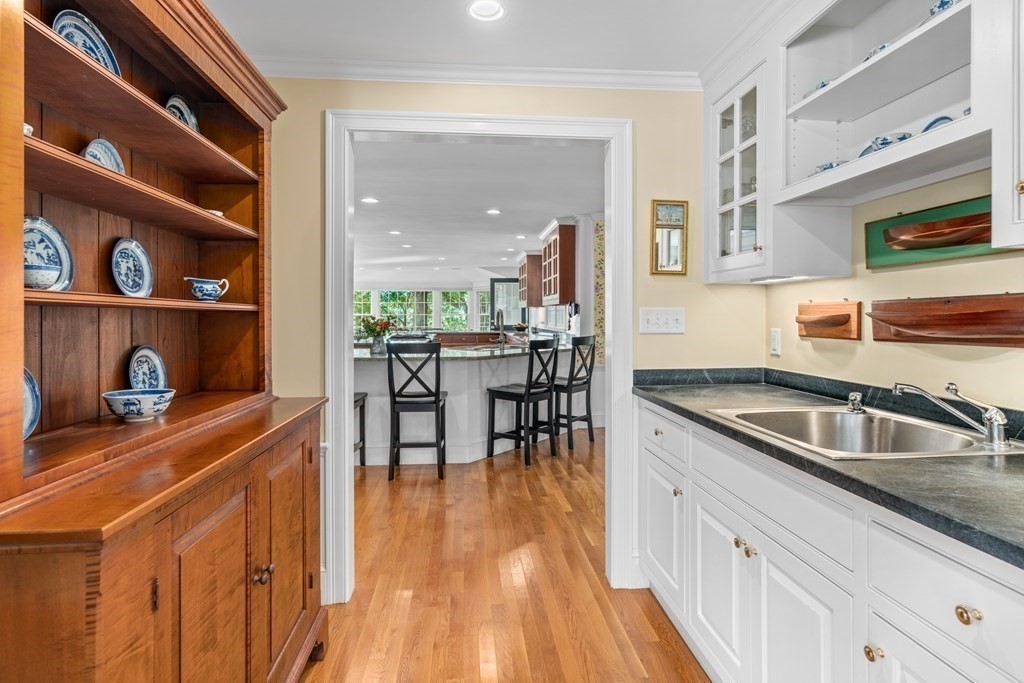 34 Sunset Road Duxbury, MA 02332 - Photo 16 of 42 a kitchen with granite countertop a sink and cabinets