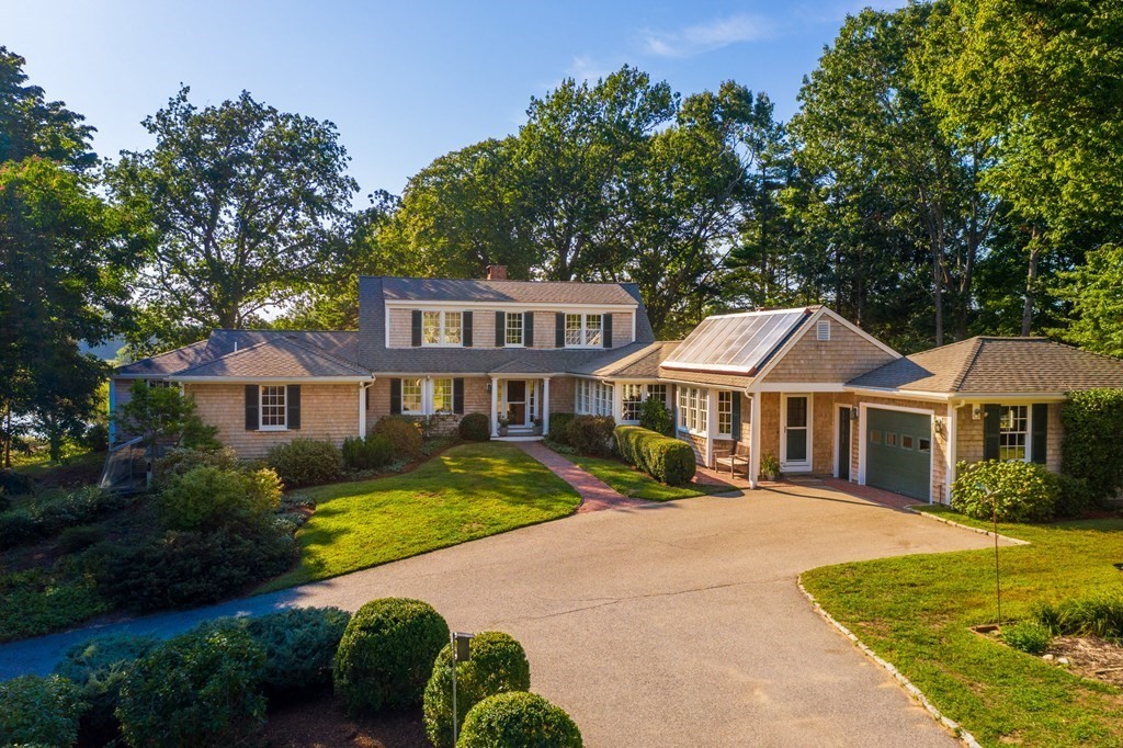 34 Sunset Road Duxbury, MA 02332 - Photo 2 of 42 a front view of a house with a garden