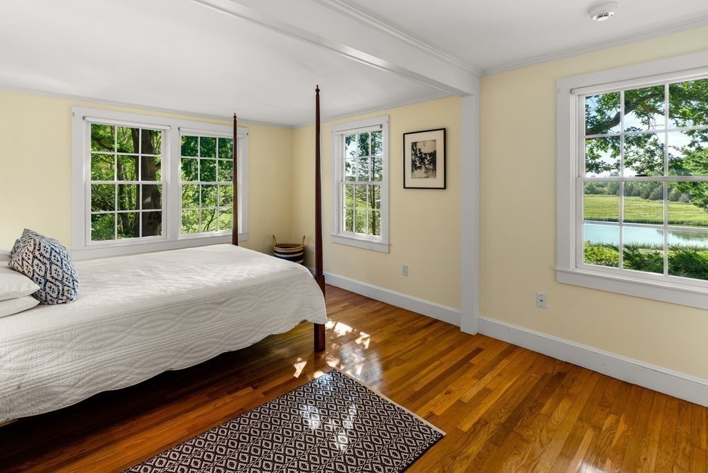 34 Sunset Road Duxbury, MA 02332 - Photo 25 of 42 a bedroom with a bed wooden floor and window
