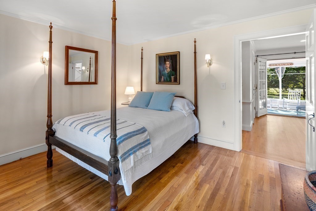 34 Sunset Road Duxbury, MA 02332 - Photo 26 of 42 a bedroom with a bed and wooden floor