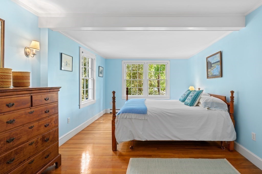 34 Sunset Road Duxbury, MA 02332 - Photo 29 of 42 a bedroom with a bed and wooden floor