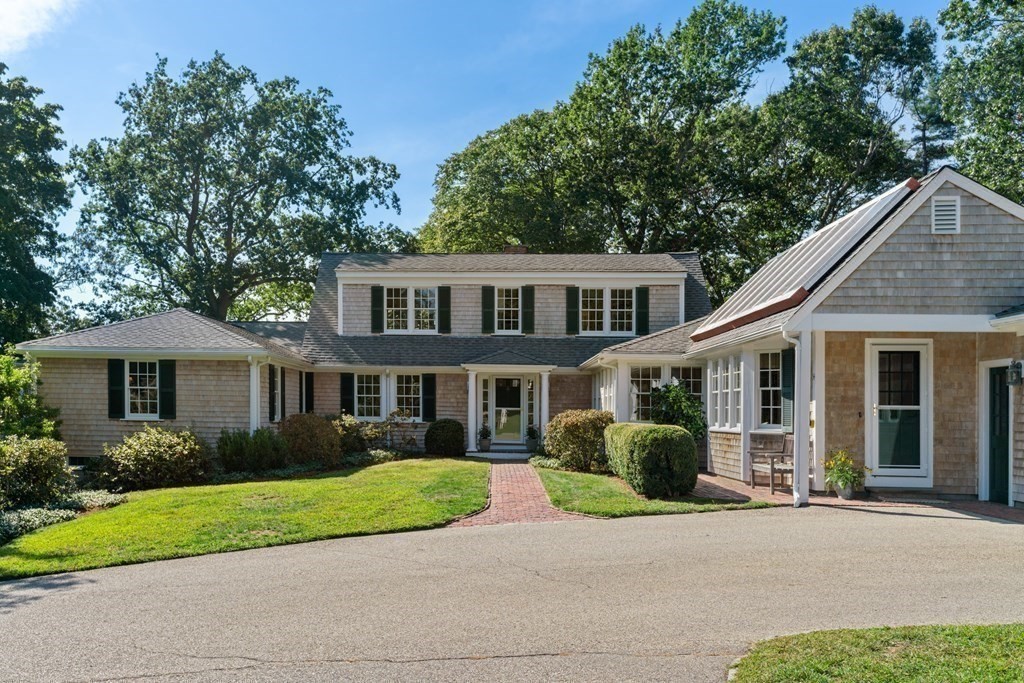 34 Sunset Road Duxbury, MA 02332 - Photo 32 of 42 a front view of a house with a garden