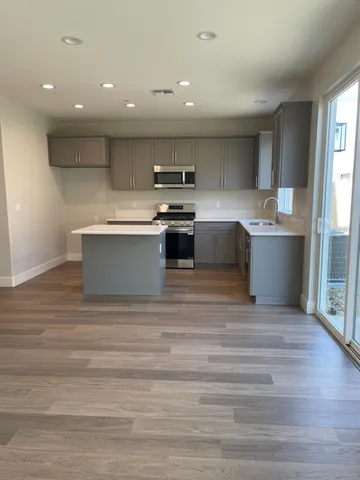 a kitchen with a stove and a sink