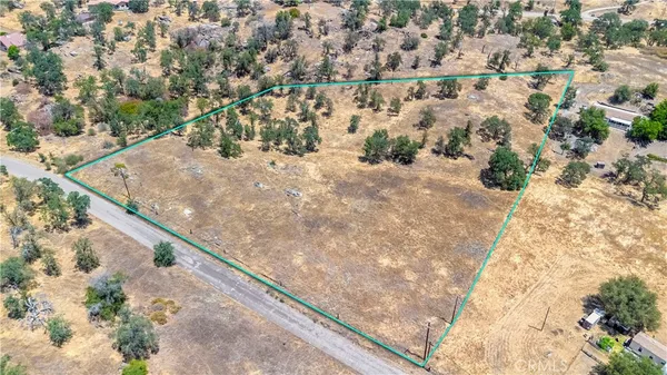 an aerial view of residential houses with yard