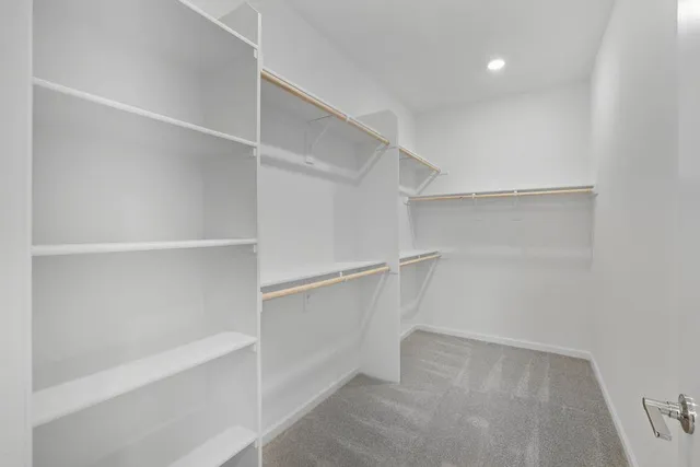 a view of an empty walk in closet