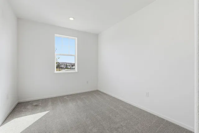 an empty room with a empty space and window