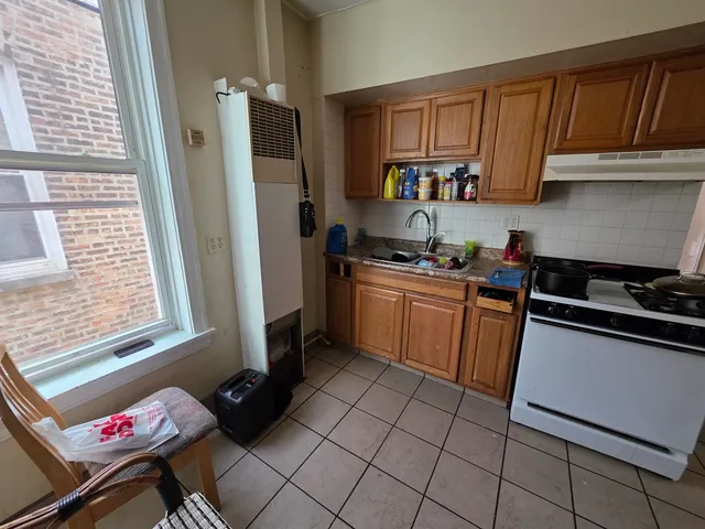 a kitchen with a sink cabinets and appliances