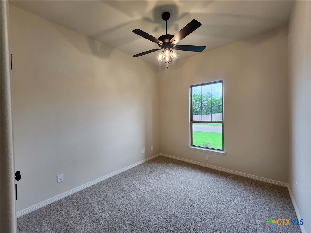 406 Talon Loop Salado, TX 76571 - Photo 16 of 31 an empty room with a window and a fan
