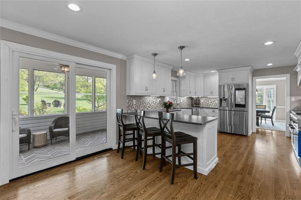 809 Timber Trail Oakdale, PA 15071 - Photo 19 of 50 a view of a dining room with furniture and wooden floor