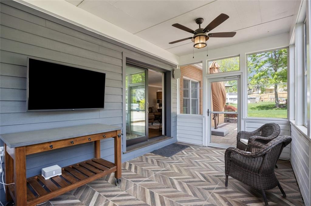 809 Timber Trail Oakdale, PA 15071 - Photo 20 of 50 a living room with furniture a flat screen tv and a fireplace