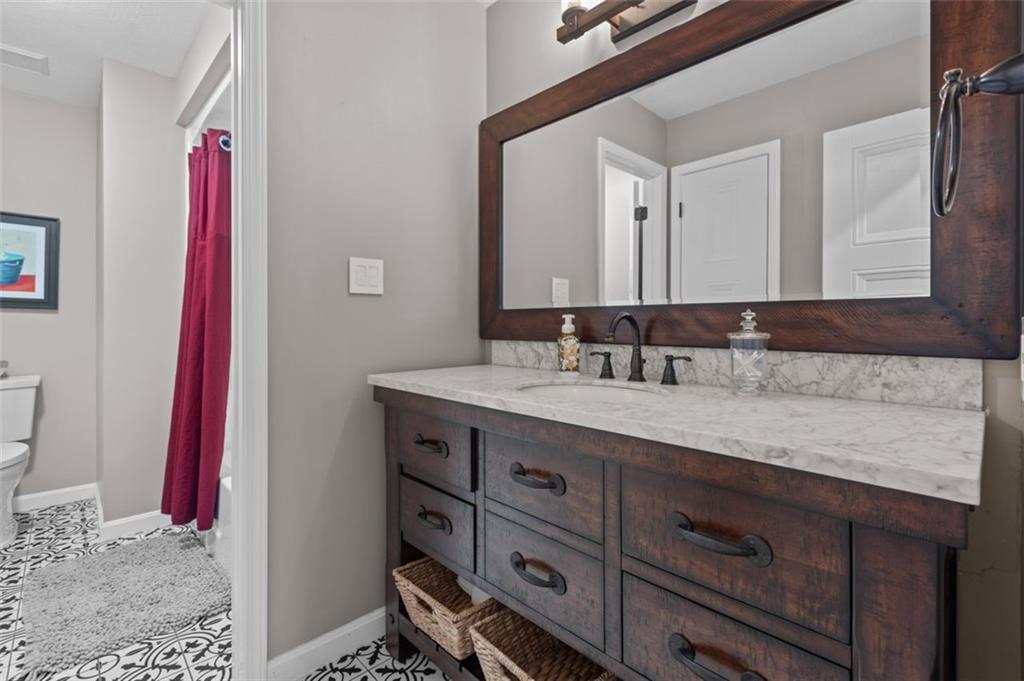 809 Timber Trail Oakdale, PA 15071 - Photo 36 of 50 a bathroom with a sink vanity and a mirror