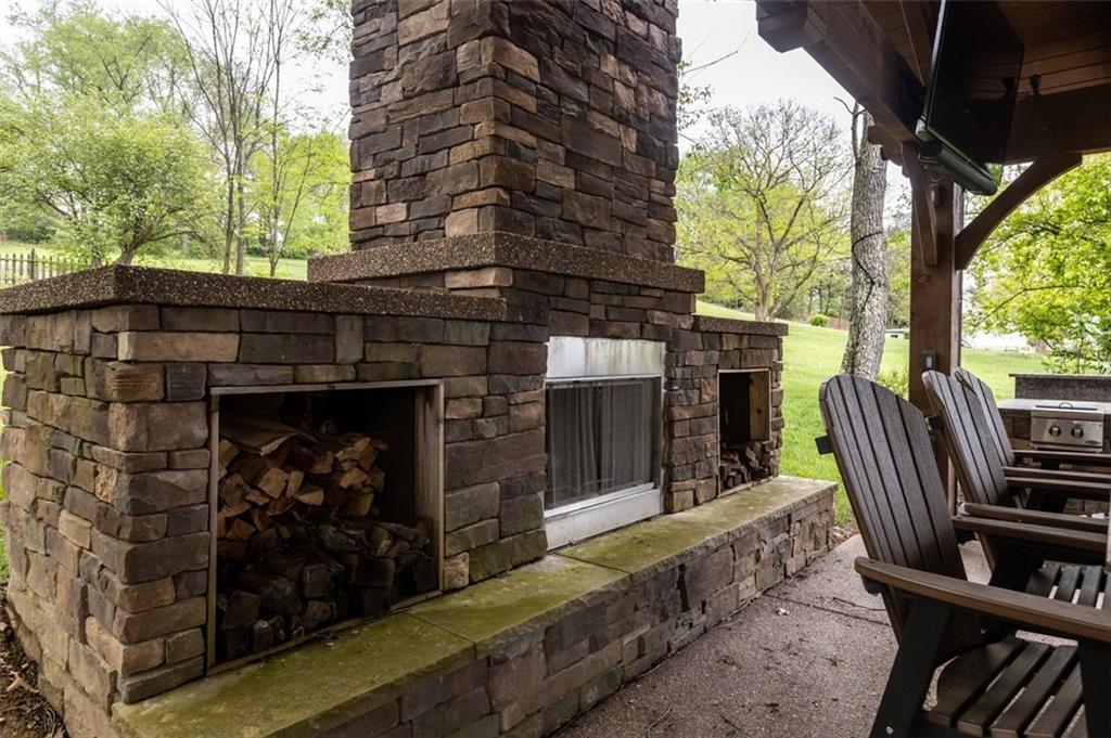 809 Timber Trail Oakdale, PA 15071 - Photo 43 of 50 a view of a patio with table and chairs with wooden floor and fence