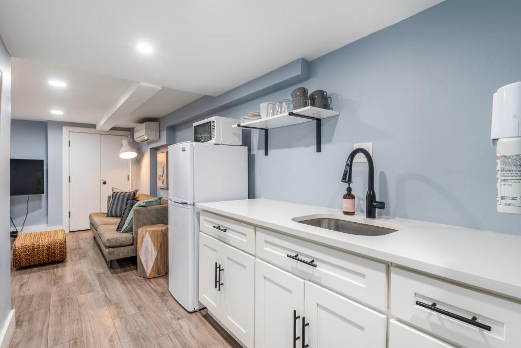 1712 Dekalb Avenue Brooklyn, NY 11237 - Photo 14 of 17 a living room with furniture and a wooden floor