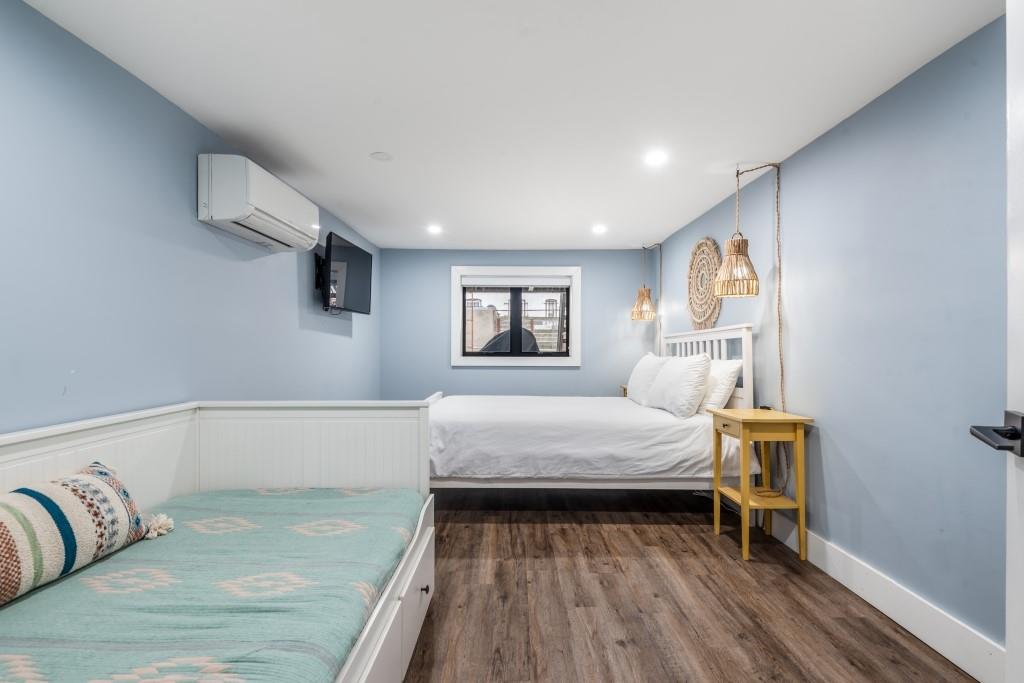 1712 Dekalb Avenue Brooklyn, NY 11237 - Photo 15 of 17 a bedroom with a bed and a window