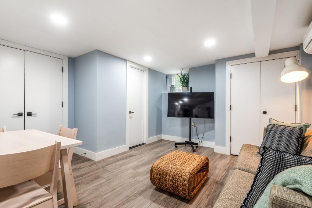 1712 Dekalb Avenue Brooklyn, NY 11237 - Photo 16 of 17 a living room with furniture and a flat screen tv