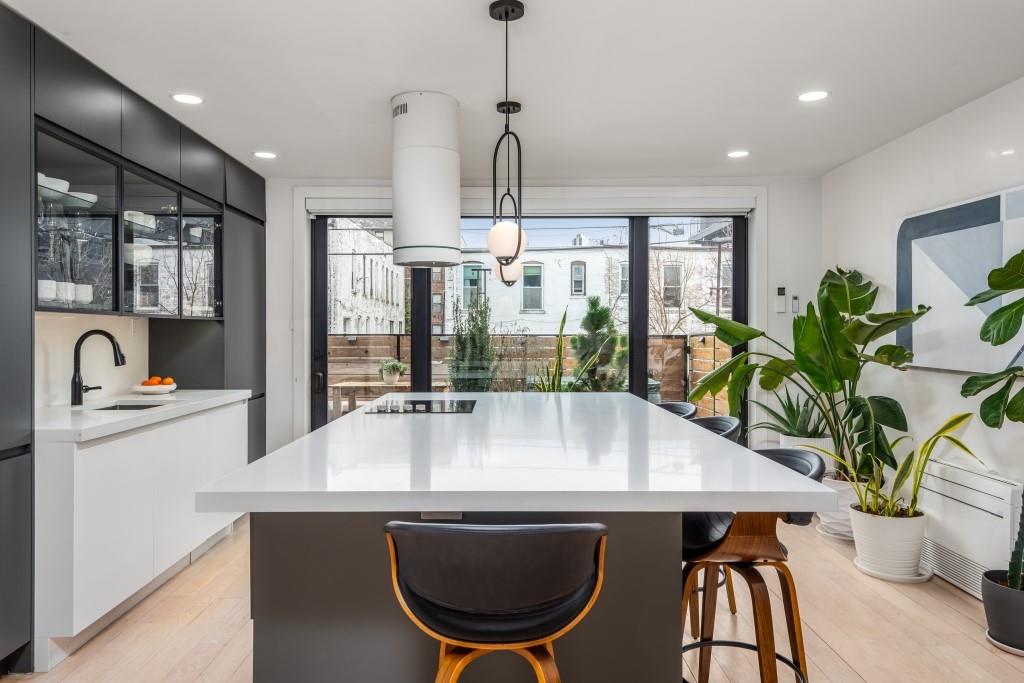 1712 Dekalb Avenue Brooklyn, NY 11237 - Photo 3 of 17 a kitchen with a table and chairs