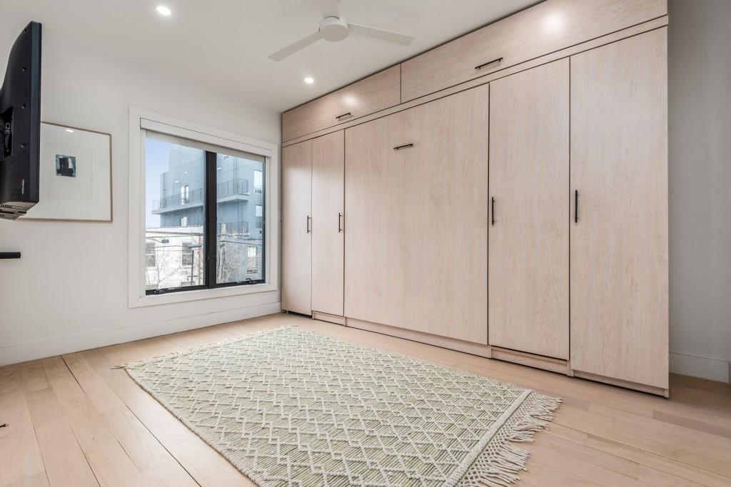 1712 Dekalb Avenue Brooklyn, NY 11237 - Photo 7 of 17 a view of an empty room with window and wooden floor