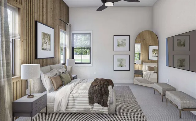 a bedroom with a bed couch and window