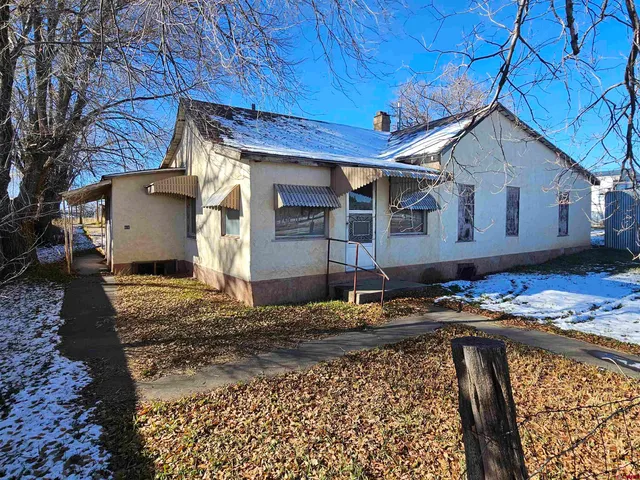 a view of a house with a snow