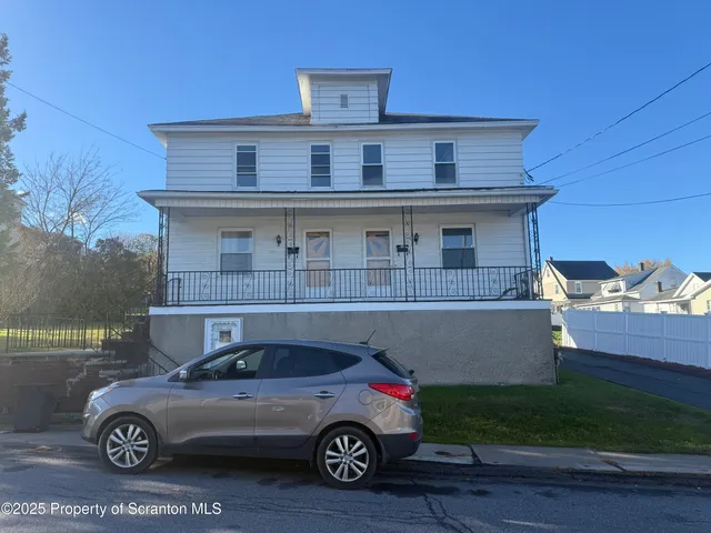 a car parked in front of a house