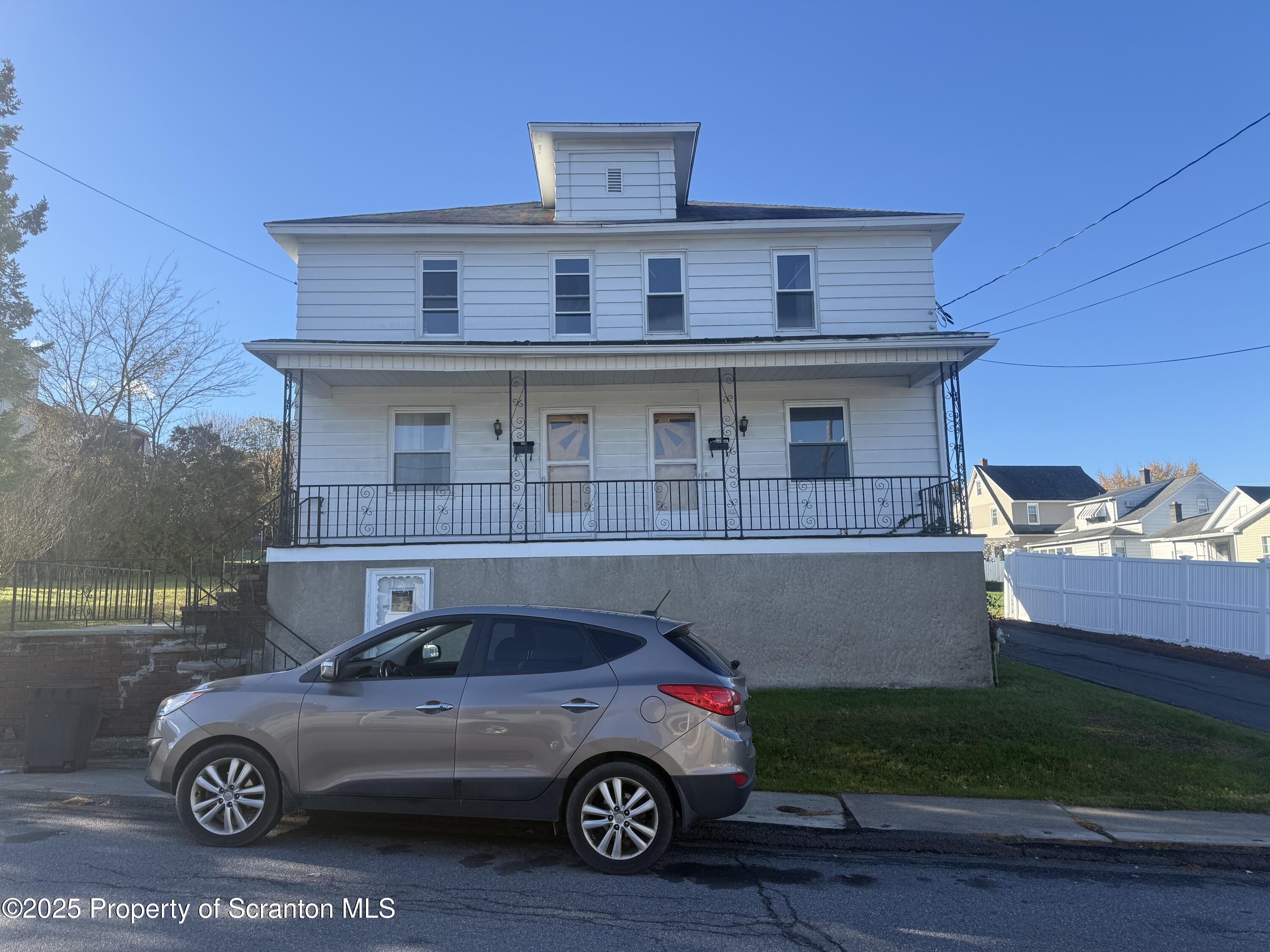 a car parked in front of a house